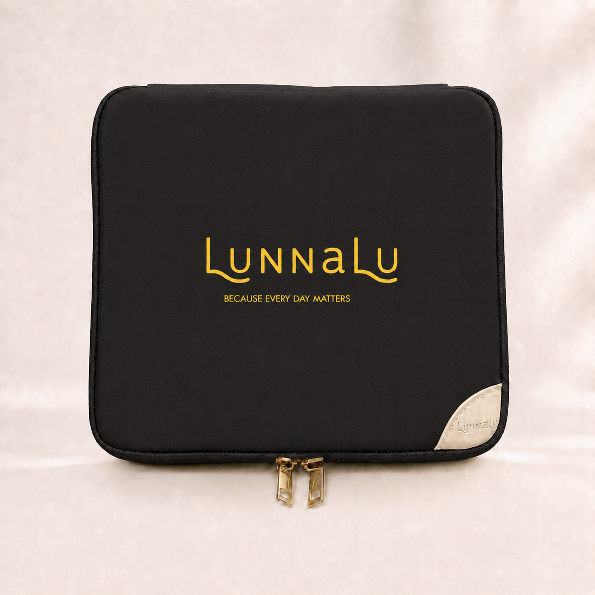 LunnaLu Large Period Organiser in black, closed, with a printed gold logo, cream corner tab and gold zip pulls