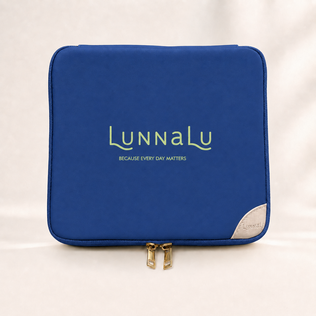 LunnaLu Large Period Organiser in dark blue, closed, with a printed lime green logo, cream corner tab and gold zip pulls