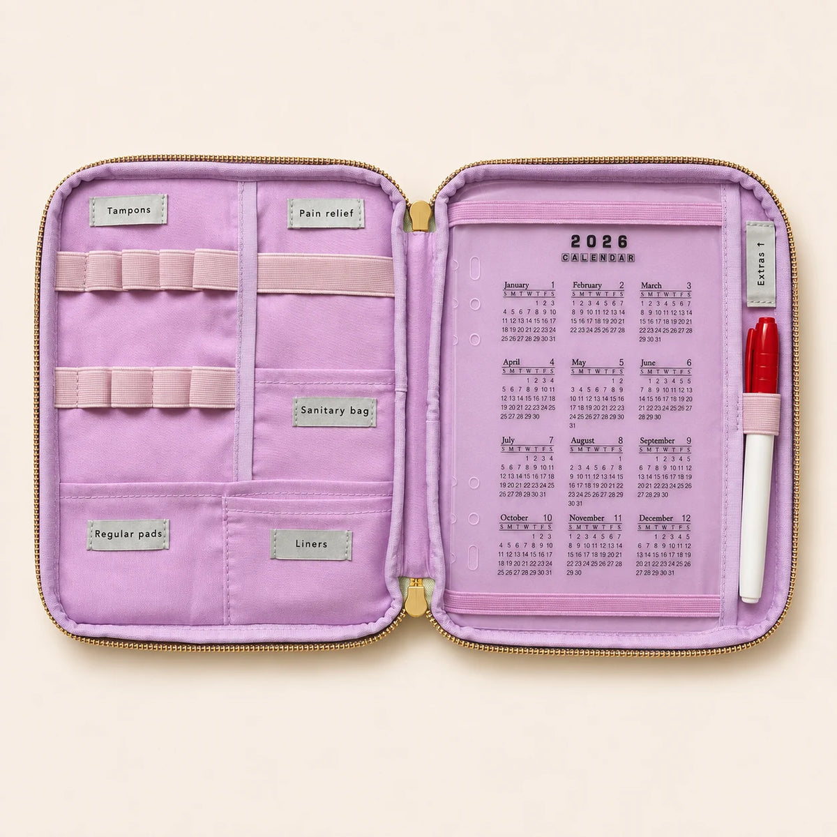 Inside the LunnaLu Large Period Organiser, open flat with a violet lining. Labelled sections for tampons, pain relief, sanitary bag, regular pads and liners, ten elastic tampon loops, a dated 2026 calendar and a permanent marker in its loop.